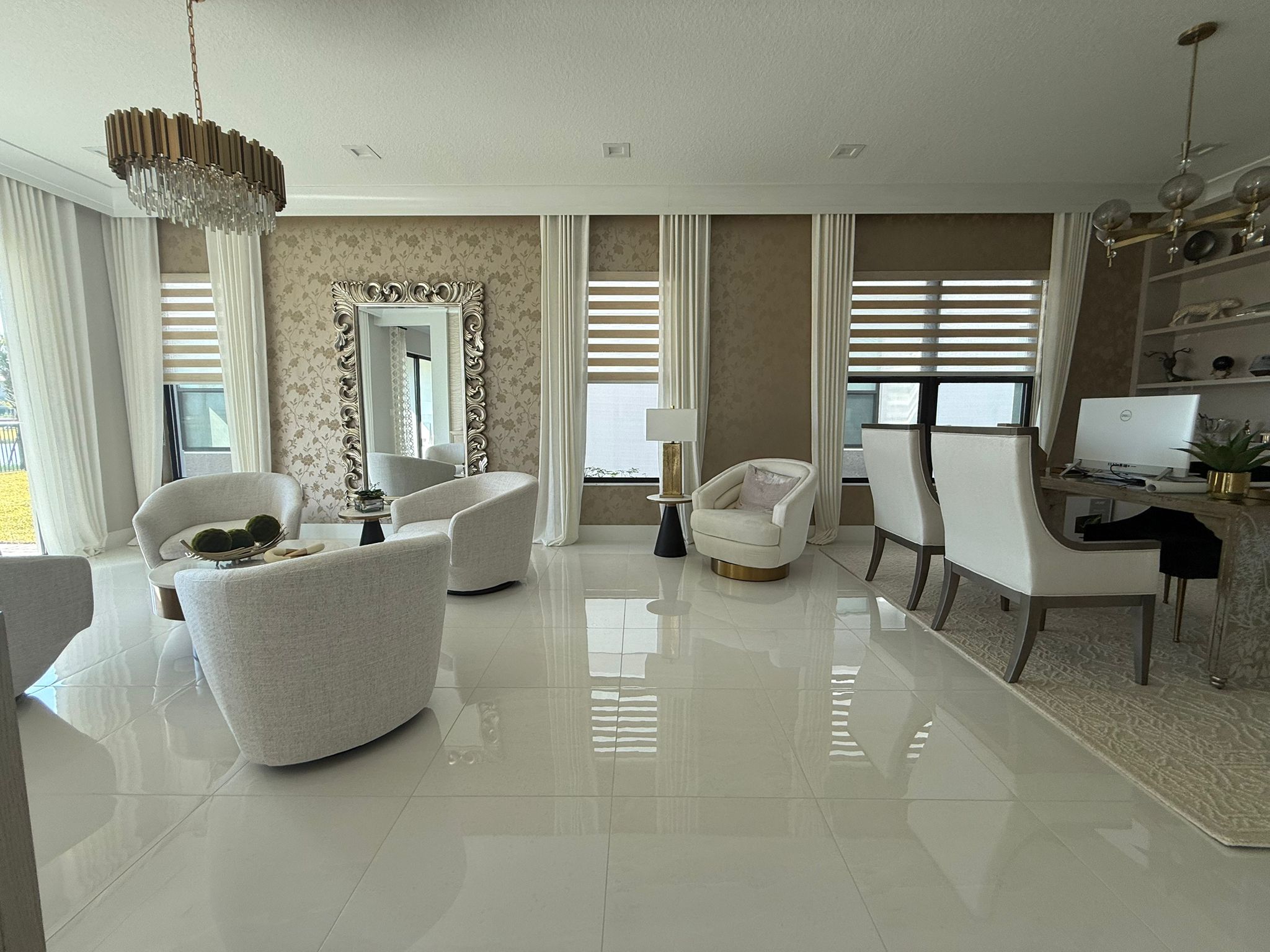 Manual zebra shades paired with floor-length draperies in a Palm Beach County home